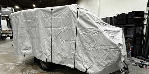 Protective cover fitted over Arkto Campers trailer